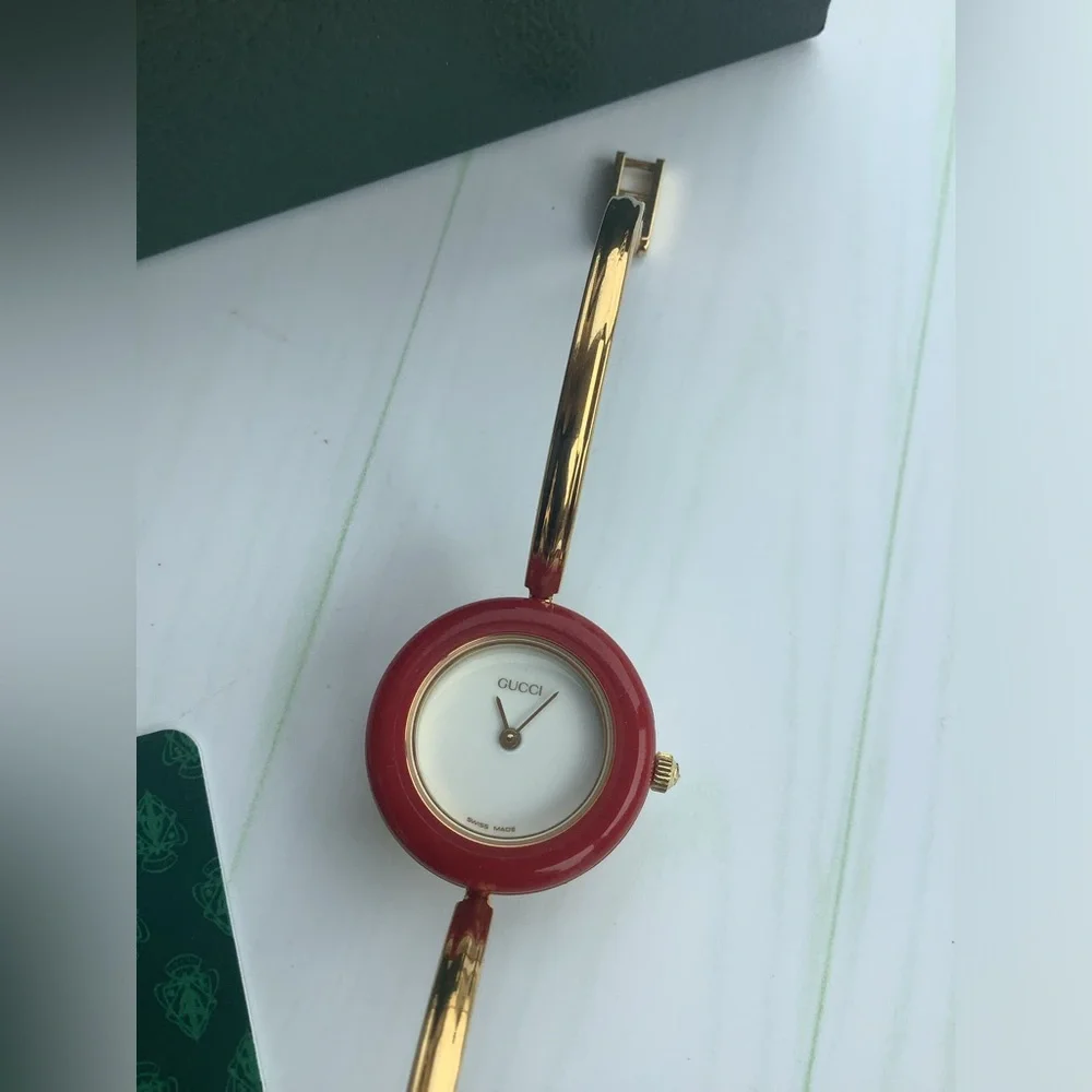 Gucci Women’s Gold Bangle Watch with Interchangeable Color Bezels
